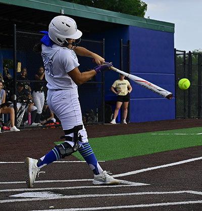 Senior Briley Tiller (27) hits the ball deep into left field driving in 1 run. The Jaguars beat Raymore-Peculier 2-1 on September 19th. 
Photo by Avery Wells