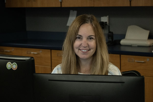 This is Jennifer Unruh at her desk. She is the new counseling secretary at Blue Springs South. 