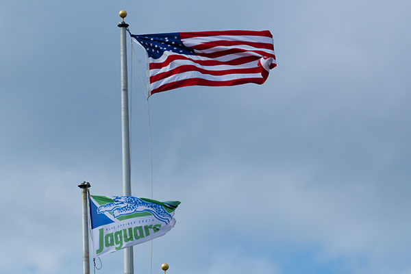 The American flag flies over Blue Springs South's flag. Former President Donald Trump and Vice-President Kamala Harris are head to head in the presidential election.