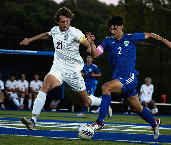 Senior Kaden Edwards, #2, keeps possession of the ball away from Lee's Summit North. Although the Jaguars lost this game 1-0, Edwards scored 32 goals this season, breaking the record for most goals in a single season at Blue Springs South. 
Photo by Avery Wells