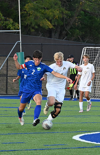 Senior Kaden Edwards, number 2 dribbles the ball against Lee Summit. The jaguars win 1-0 to lee summit on September 16 in double overtime. 